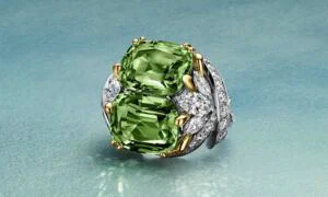 Petals Unenhanced Peridot Ring Ring in platinum and 18k yellow gold with two cushion-cut unenhanced peridots of 15.92 total carats and diamonds © TIFFANY & Co.