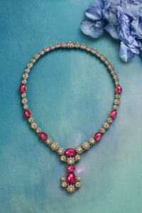 Blossom Rubellite NecklaceNecklace in platinum and 18k yellow gold with seven cushion cabochon rubellites of 53.11 total carats, two oval cabochon rubellites of 10.84 total carats and diamonds © TIFFANY & Co.