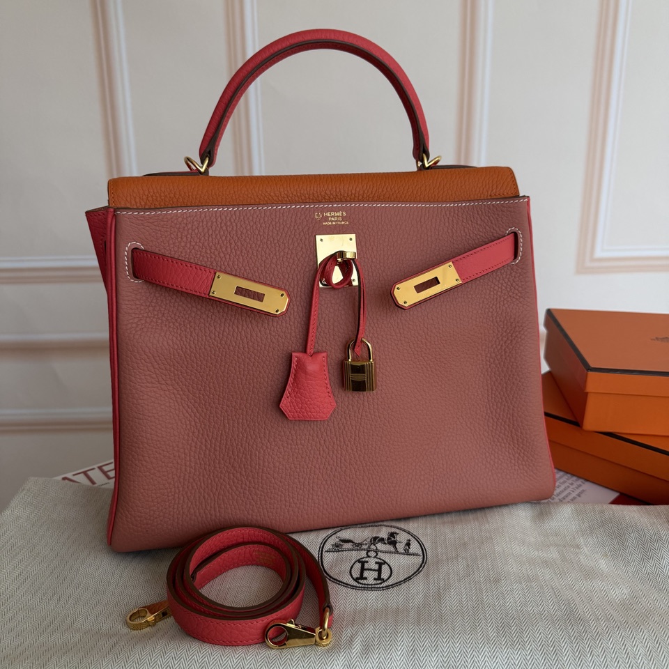 Sac Hermès Kelly orange et rouge avec sa boite Hermès orange